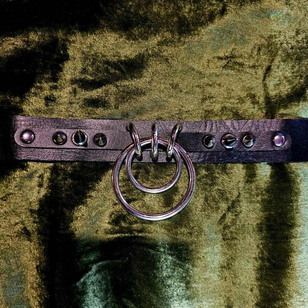 Adjustable faux leather choker with metal hardware, o-ring and spikes